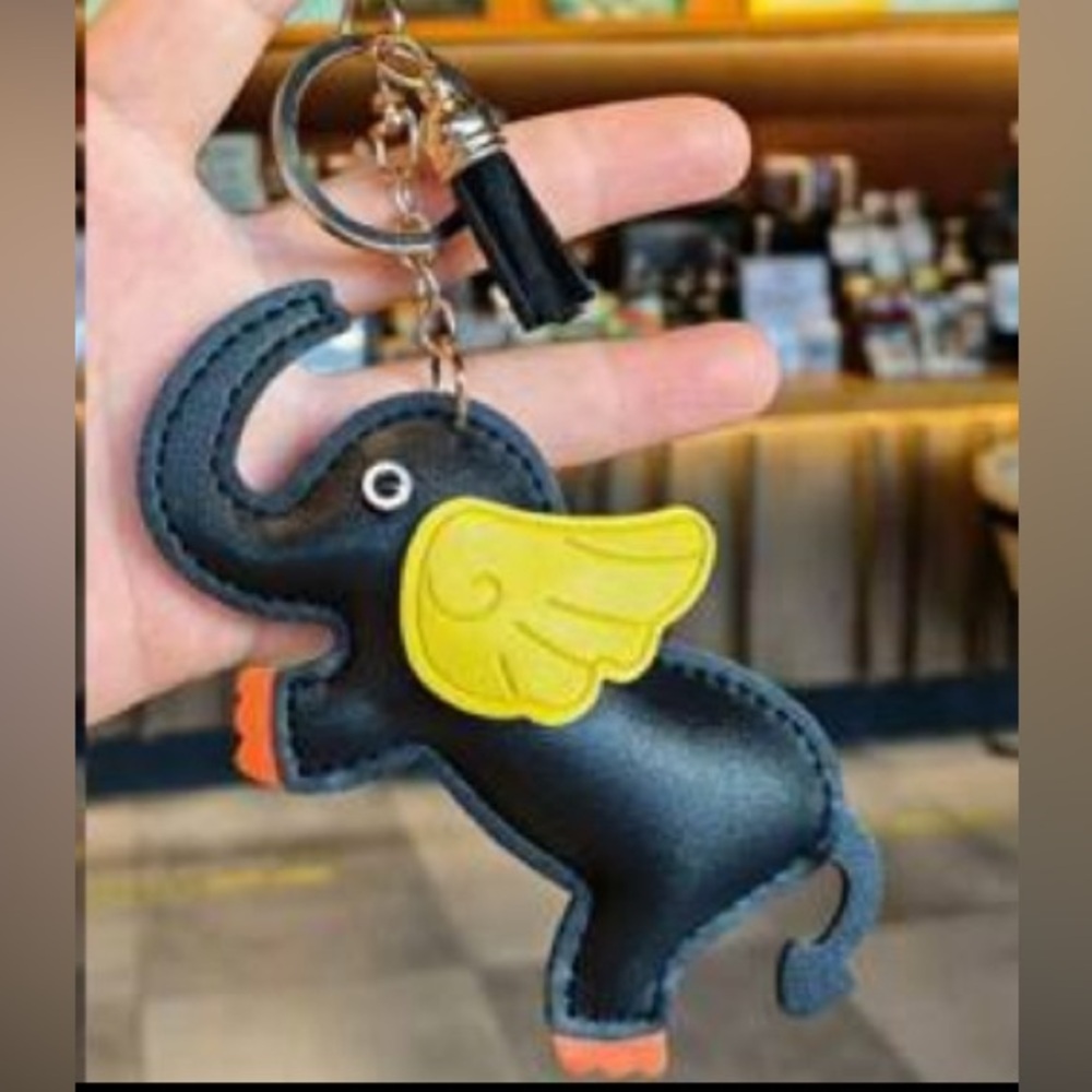Charming Black Elephant Keychain with Yellow Wings